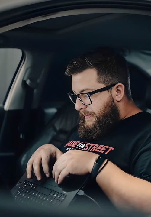 Robson Licursi running vehicle diagnostics from the driver's seat